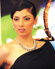 A model launching a gems and jewellery collection during the Dwarka's Ratnabhushan Utsav’03 in the Capital on Friday.