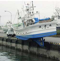 A fishing boat is run aground at Tokachi port in Hokkaido 