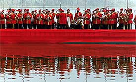 Kashmir police band performs on a boat during the inaugural ceremony