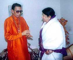 Shiv Sena chief Bal Thackeray greets melody queen Lata Mangeshkar on her 75th birthday at Matoshri in Mumbai.