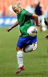 Milene Domingues, wife of Brazilian superstar Ronaldo, warms up with other members of the Brazilian womens football team 