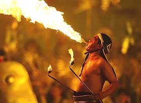 A fire-eater performs during the open-air opera "Aida" at Workers' Stadium in Beijing