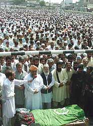 Pakistan's Islamic leader Maulana Fazal-ur-Rehman (foreground) leads funeral prayers for Nawabzada Nasarullah Khan in Khan Garh, 65 km from Multan, on Sunday.