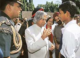 An inquisitive A.P.J. Abdul Kalam interacts with a schoolboy in Chandigarh on Monday.