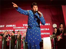 Punjabi singer Gurdas Mann and his group perform during the first zonal youth festival of Kurukshetra University at BRS Dental College, Kot Billa, on Sunday night.