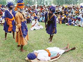 A daring feat being performed by a Nihang in Ambala on Monday