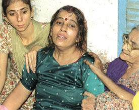 The grieving mother of the three children who were killed in the fire in their house in Chander Nagar in East Delhi