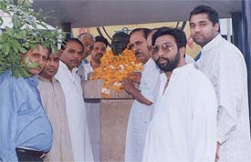 Congress functionaries led by PPCC Secretary Ramesh Joshi offer floral tributes at the bust of Mahatma Gandhi