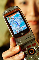 Japanese telecom operator KDDI Corp unveils the new mobile handset