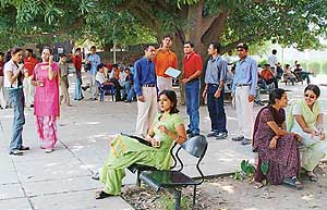 Students relax outside the Students Centre