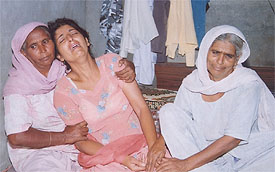 Ravis sister cries inconsolably after the news of his murder reached Dhamot village