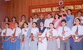 Prize winners of inter-school declamation contest with their trophies and mementoes at Kundan Vidya Mandir 