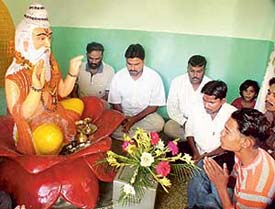 Devotees perform puja on the occasion of Valmiki Jayanti at Jawahar Nagar in Ludhiana on Friday. 