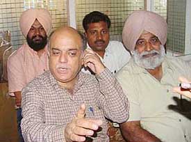 Mr Inderjit Singh, vice-president, and Mr G.L. Jogi, general secretary of the Sanchar Nigam Executive Association address the open session in Ludhiana on Thursday.