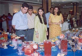 The Deputy Commissioner, Mr Anurag Verma, and his wife go around an exhibition of paintings and ornamental candles