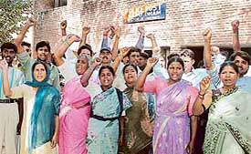 Residents of Bapu Dham Colony raise slogans at police station in the colony on Sunday in Chandigarh. They were protesting against delay on the part of the police