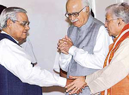 Human Resource Development Minister Murli Manohar Joshi greets Prime Minister Atal Bihari Vajpayee as Deputy Prime Minister Lal Krishan Advani looks on