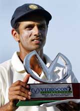 Indias Rahul Dravid displays his man-of-the match trophy