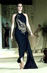 A model presents a creation by Turkish designer Zuhal Yorganzioglu in Lahore on Sunday