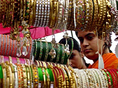 Too many designs and colours of bangles seem to put the girl in a fix to select the right bangles