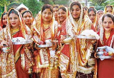 Decked up in their festive best, women offer prayers on the occasion of Karva Chauth