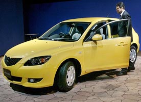 Mazda Motor Corp's new Axela is displayed at an unveiling in Tokyo