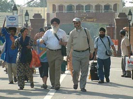 A jatha of Sikh pilgrims from the UK arrives at Wagah on Wednesday. 