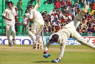 Wicketkeeper Parthiv Patel fails to collect the ball cleanly as bowler L. Balaji and New Zealand's Lou Vincent look on
