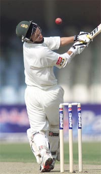 South African batsman Gary Kirsten unsuccessfully avoids a bouncer off Pakistani pacer Shoaib Akhtar during first day's play of the first Test in Lahore.  Reuters photo