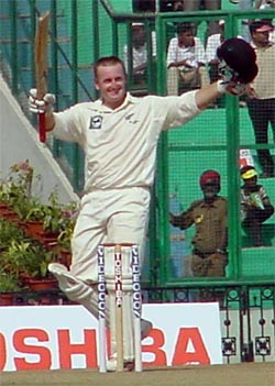 New Zealands Scott Styris acknowledges his century on the second day of the second Test against India at Mohali.  A Tribune photograph