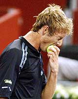 Spain's Juan Carlos Ferrero bites a ball after losing a point in a Madrid Tennis Masters 3nd round match against fellow countryman Felix Mantilla. Ferrero won.  AP/PTI