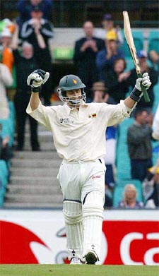 Zimbabwe's Stuart Carlisle celebrates his century on the first day of the second Test against Australia in Sydney.  AP/PTI photo