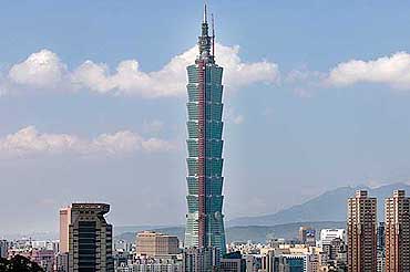 The Taipei 101 tower looms over the city of Taipei after officially reaching 508 meters (1666.7 feet) to become the world's tallest office building.