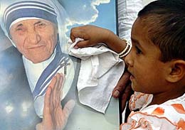 A child cleans Mother Teresas photograph at Shishu Bhavan in Ambala Cantonment on Saturday. Mother Teresas beatification will take place on Sunday