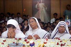 Nuns pray at the tomb of Mother Teresa in Kolkata on Sunday. 