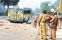 A damaged DTC bus, which was targeted by the crowd protesting against the death of a youth in police custody at Madipur area in the Capital on Tuesday.