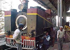 Railway workers get a steam engine ready for the celebrations of 100 years of the Shimla-Kalka railway track 