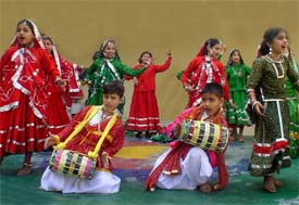 Students of New Senior Secondary School present a dance at the utsav