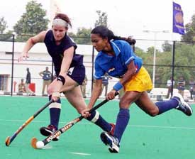 Indias Jyoti Kullu battles for the ball with Bee Kerry of South Africa 