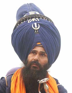 A Nihang with a traditional turban having a length of 101 metres on the occasion of Bandi Chhor Divas in Amritsar