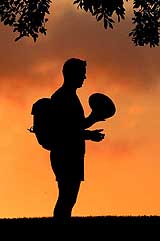South Africa's Jorrie Muller is silhouetted against the setting sun after a training session in Brisbane 