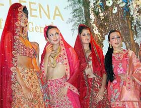 Models display creations of "Ashima - Leena's Fall/Winter -2003 collection", at a fashion show in New Delhi 