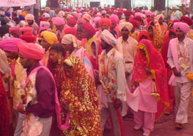 Couples arrive for the mass marriage ceremony at Baddowal