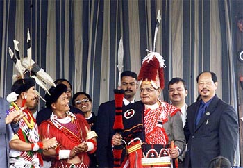 Prime Minister Atal Bihari Vajpayee wears a traditional Naga costume at a public reception in Kohima