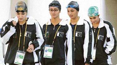 Pakistani swimmers Sana Wahid, Mahera Karim , Ayesha Tajwar (2-R) and Rubab Raza arrive for the womens 4x100m freestyle relay at the 1st Afro-Asian Games