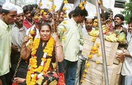 Eunuch candidate Suraiya of the newly formed Eunuch party "Jiti Jitai Party" is being weighed by fruits during her campaign in Bhopal 