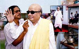 Artist Susanta Roy gives final touches on the wax statue of D.M.K. chief M. Karunanidhi at his studio in Burdwan