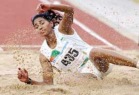 Anju Bobby George lands on sand during the womens long jump event 