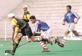 Players of Govt Model Sr Secondary School, Jalandhar and Army Boys Sports BRC Danapur during the 32nd Junior Nehru Hockey Tournament