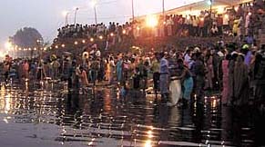 Devotees converge on the bank of Yamuna for Chatt puja in the Capital on Friday. 